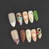 Glam crystal press-on nails with multicolor gems and 3D carving accents