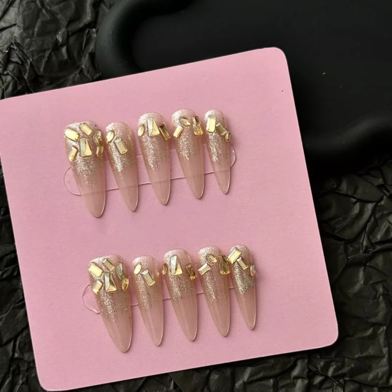 Full set of Glitter Gradient Press-On Nails with gold accents in display box