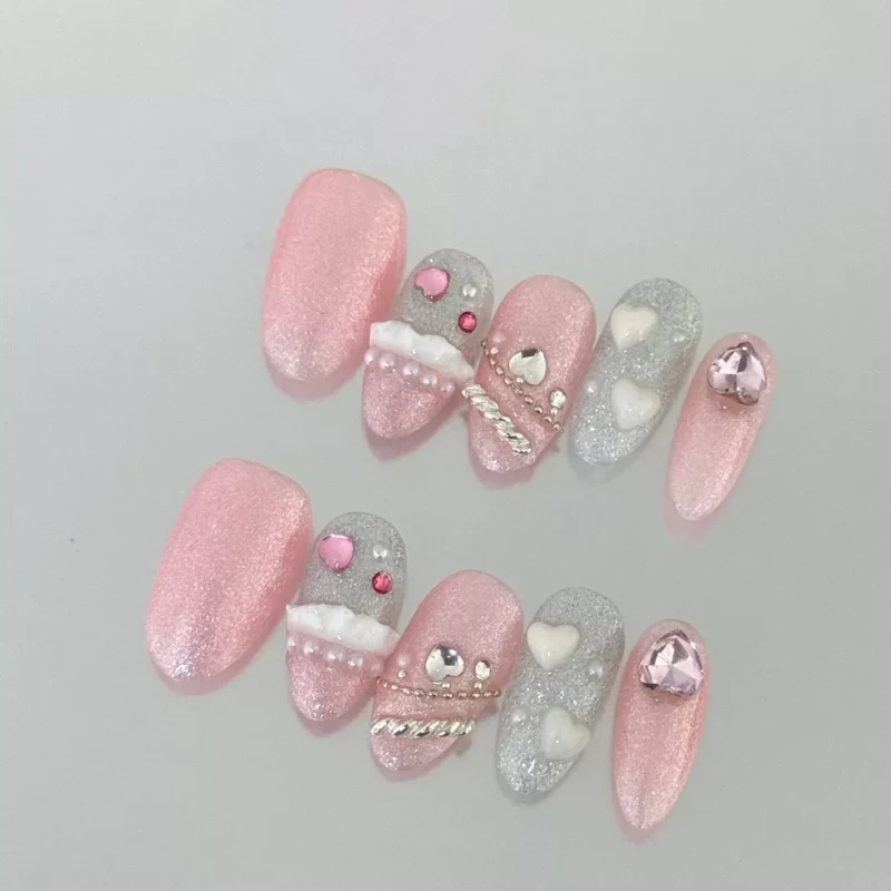 Glitter Cute Press-On Nails in pastel pink and silver on white surface