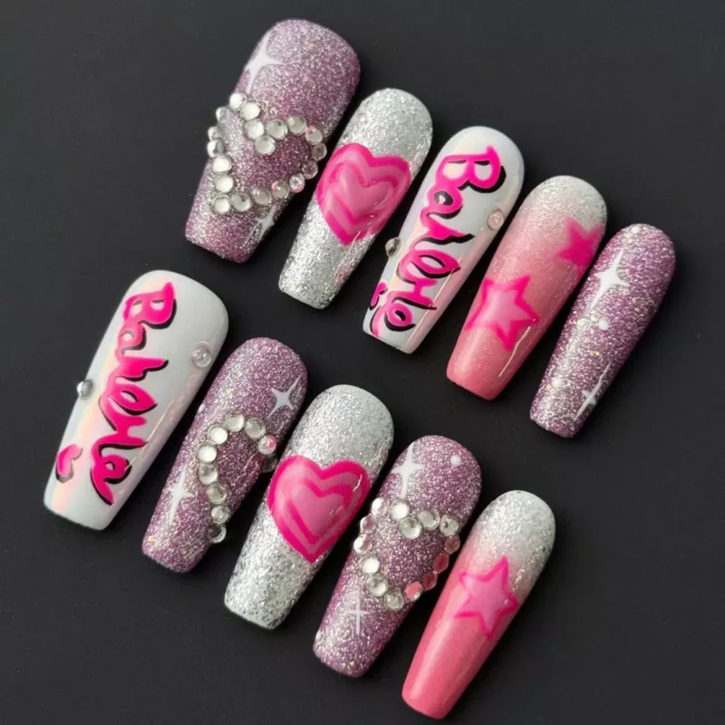 Glitter Pink Press-On Nails with Barbie font and rhinestone heart charms – front angle