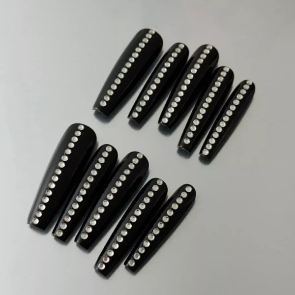 Glossy Black Press-On Nails featuring rhinestone minimalist accents, flat layout