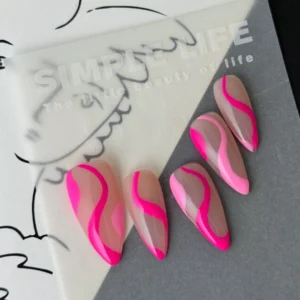 Y2K pink press-on nails with glossy nude and hot pink pattern