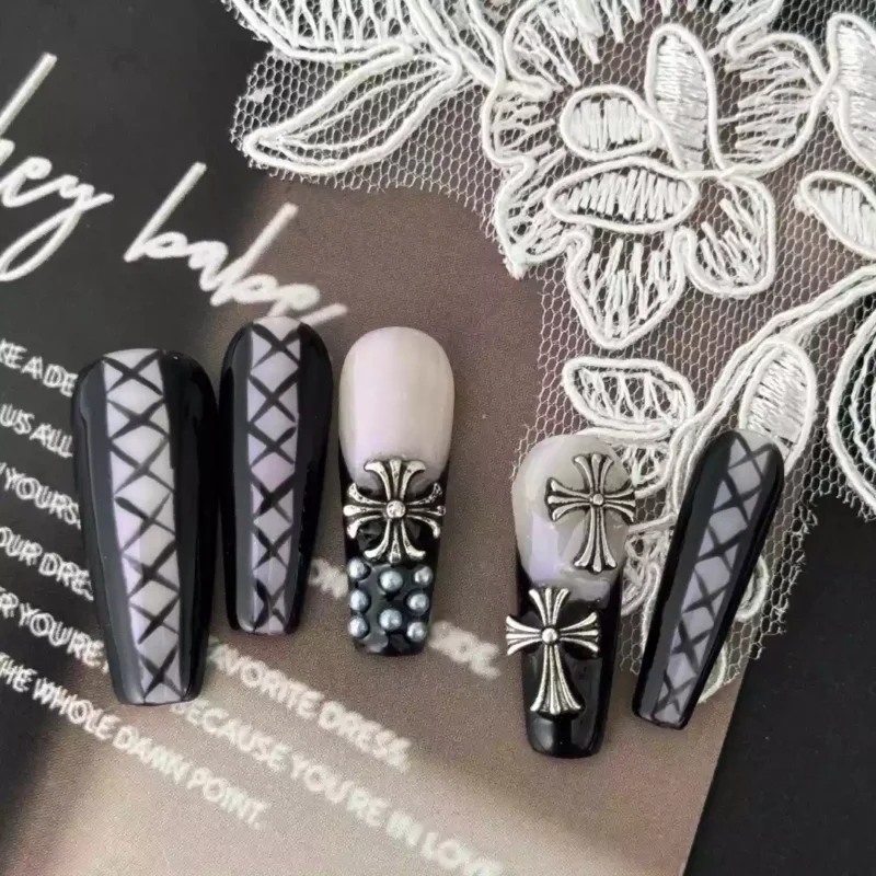 Gothic black press-on nails on lace background