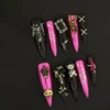 Gothic Pink Chrome Press-On Nails with 3D Halloween charms on black background
