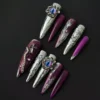 Gothic purple press-on nails with 3D cat eye charm and cross accent – full set view
