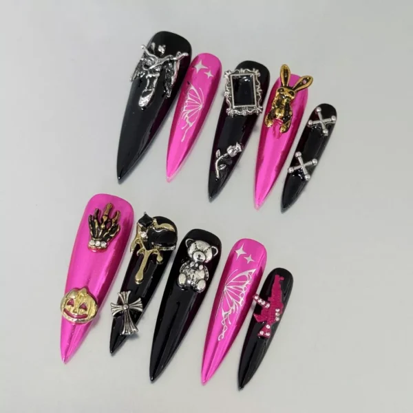 Close-up of Halloween Press-On Nails with vibrant chrome pink and gothic designs