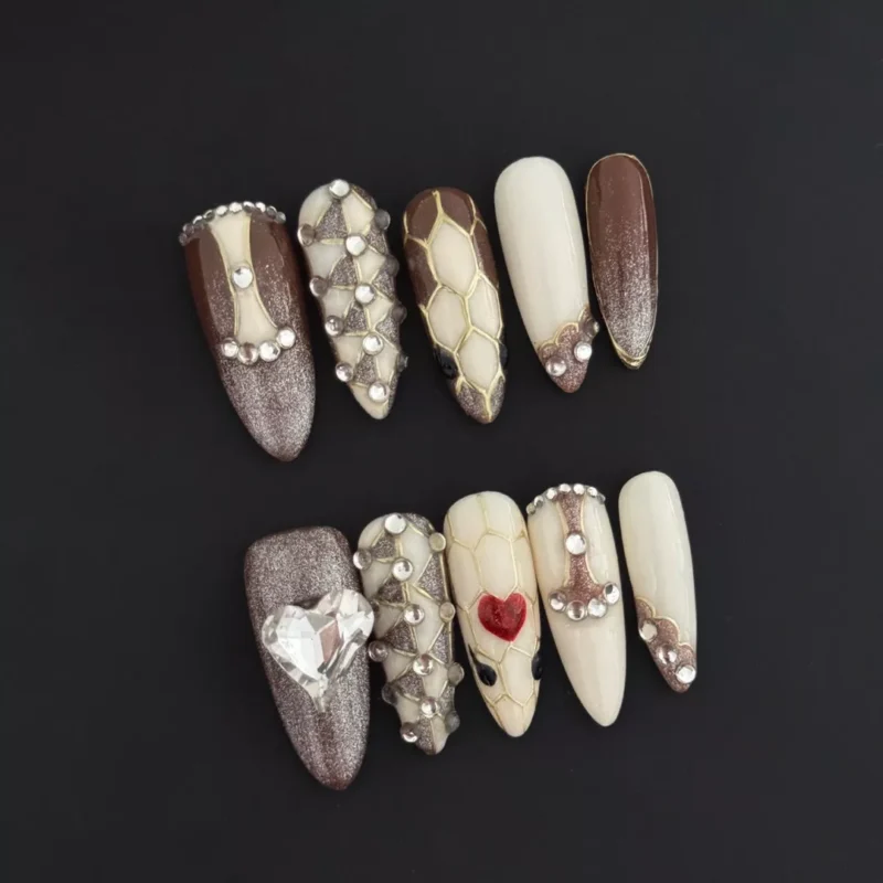 Heart Gem Press-On Nails with snake texture and crystal accents on nude brown base