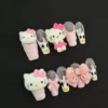 Hello Kitty Charm Press-On Nails – Pink Glitter & 3D Cartoon Bow Set 7 Hello Kitty Charm Press-On Nails featuring pink glitter, 3D bows, and cartoon accents