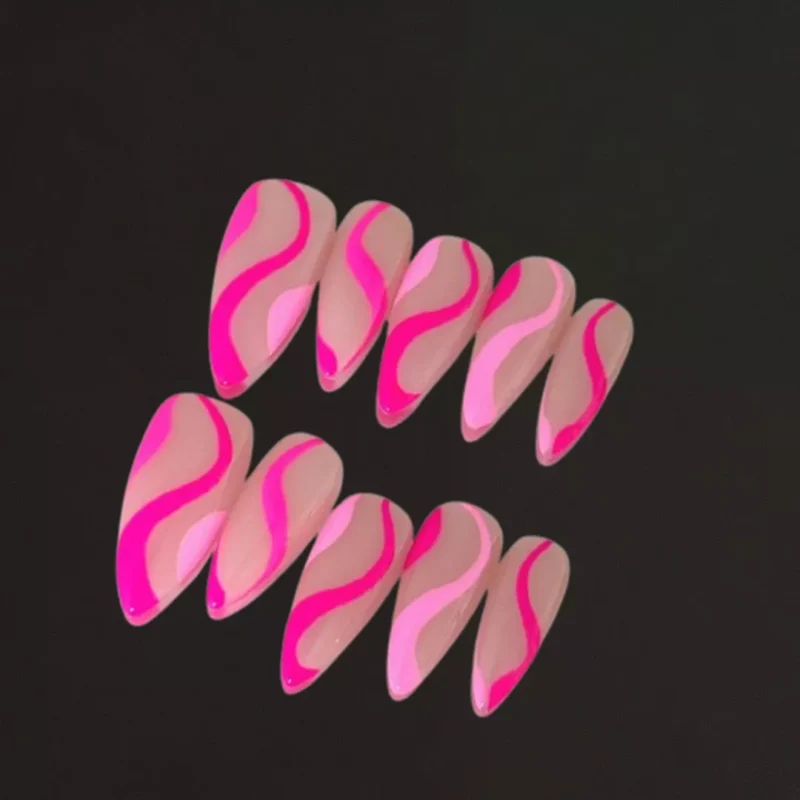 Almond Press-On Nails in nude base with hot pink wave design, flat layout