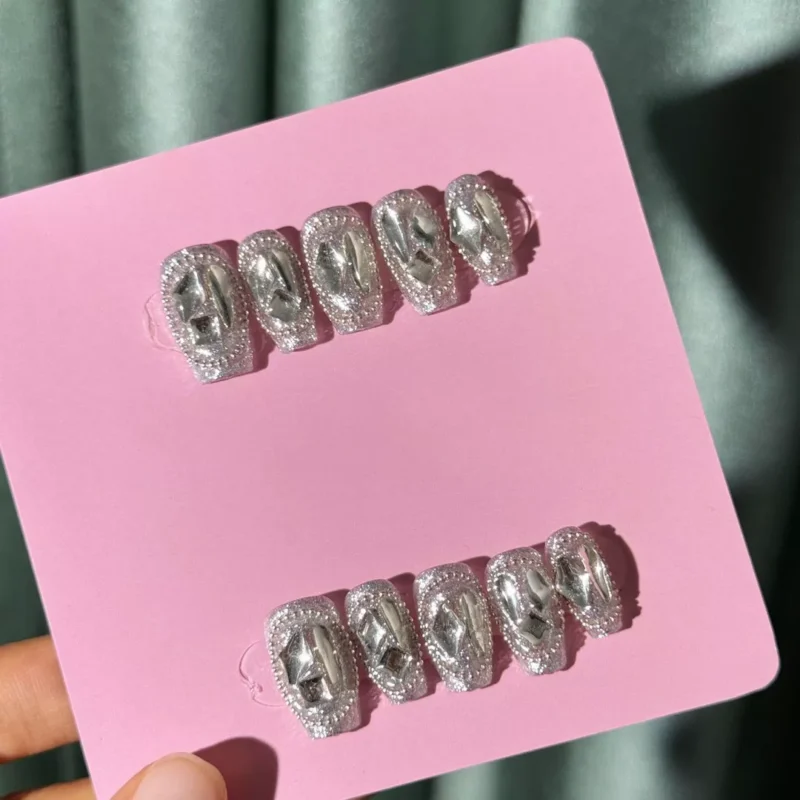 Irregular mirror chrome press-on nails with silver glitter background