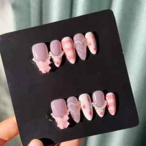 Full set of kawaii press-on nails in box with strawberries and bows