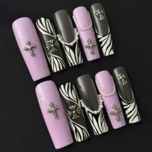 Lavender coffin-shaped press-on nails with zebra stripe and gothic jewelry