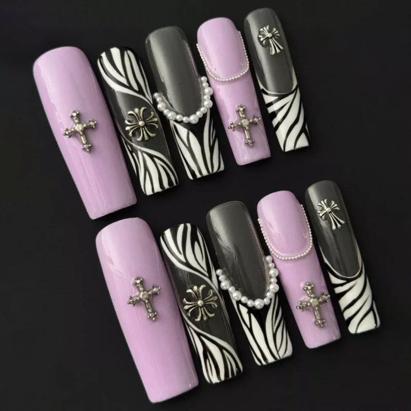Lavender coffin-shaped press-on nails with zebra stripe and gothic jewelry