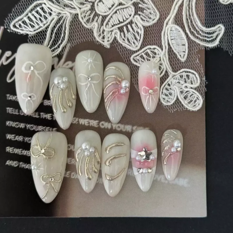Blush Pink Nails in long almond shape star pearl accents