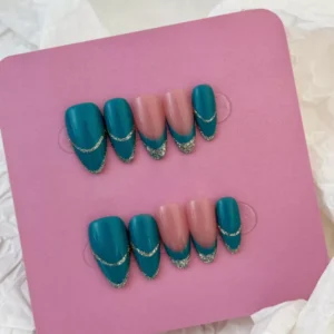 Long glitter press-on nails in teal and nude with metallic accents – styled display