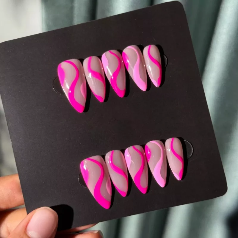 Cute press-on nails in almond shape with pink wave line art