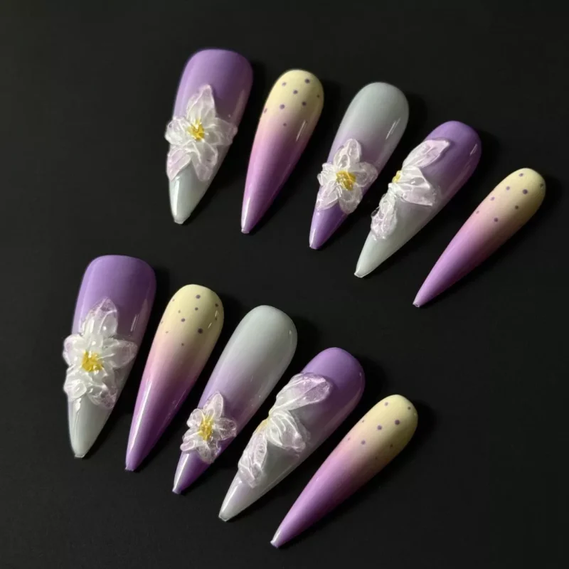 Purple ombre long stiletto nails with white sculpted flowers