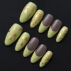 Matte Light Green Press-On Nails - Mixed Set with Gold Foil & Taupe Tips 5 Matte light green press-on nails with taupe French tips and gold foil – flat lay view