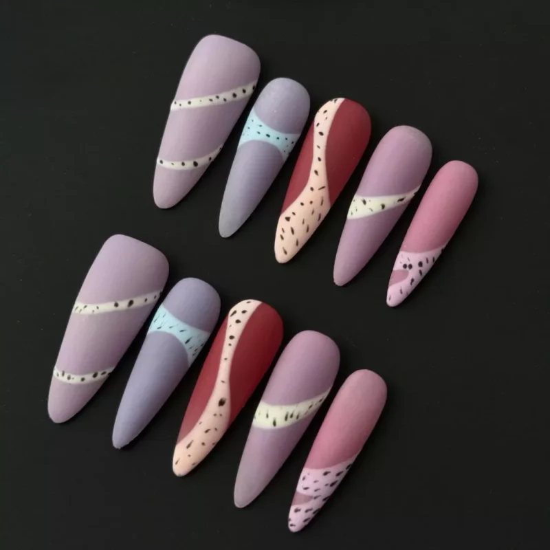 Side view of matte almond press-on nails with multicolor block design