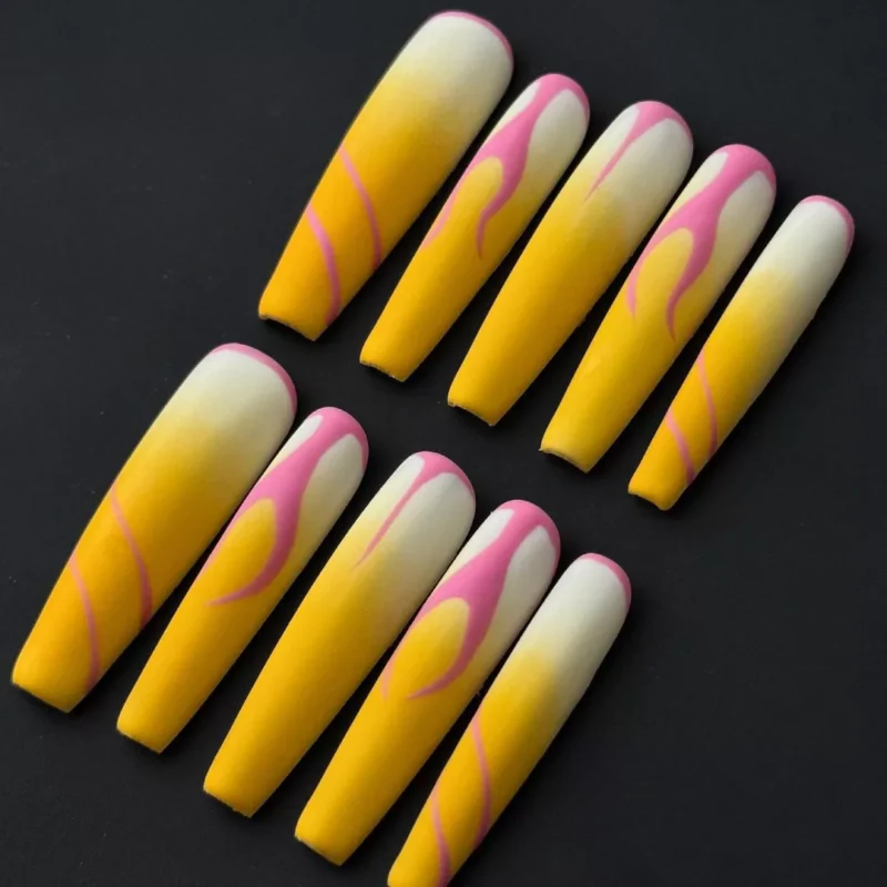 Matte racing press-on nails with bold pink and yellow design
