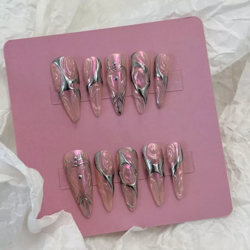 Metallic Swirl Press-On Nails Displayed with Futuristic Styling