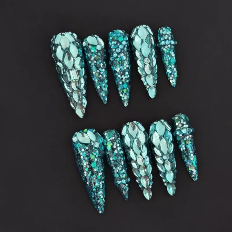 Midnight Ocean Press-On Nails with full rhinestone armor on teal glitter stiletto tips