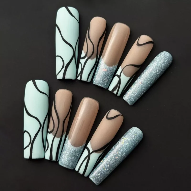 Side angle of mint nude press-on nails with coffin shape and glitter finish