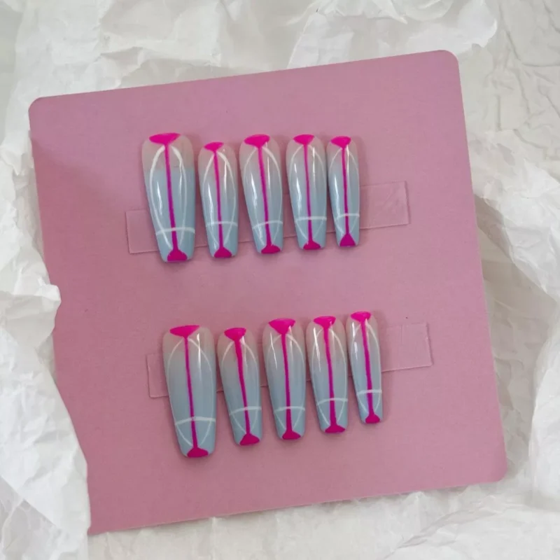 Geometric press-on nails in grey and pink with coffin shape and line accents