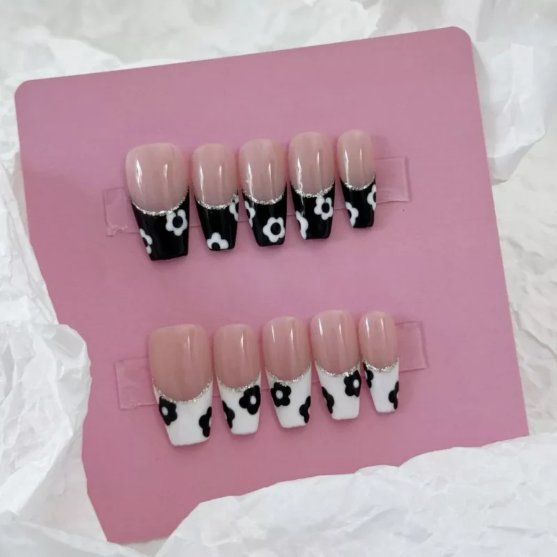 Black and White Press-On Nails with nude base and glitter accents