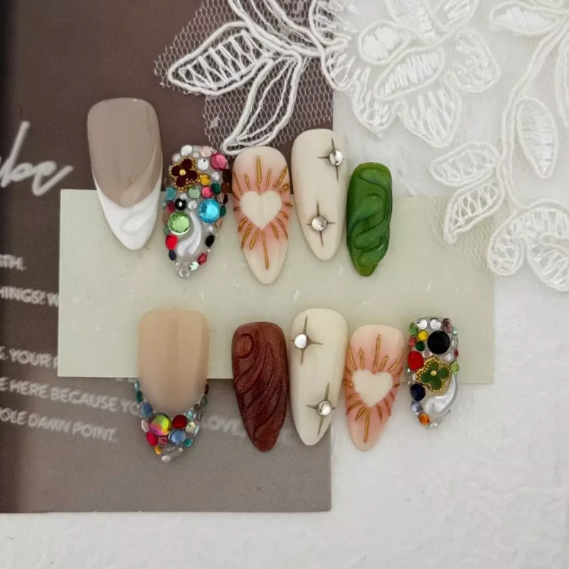 Multicolor gem press-on nails with sculpted textures and heart accents