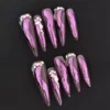 Night Mirage Press-On Nails with pink chrome brushstroke and rhinestone accents