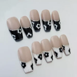 Nude Base Press-On Nails with artistic black and white floral design