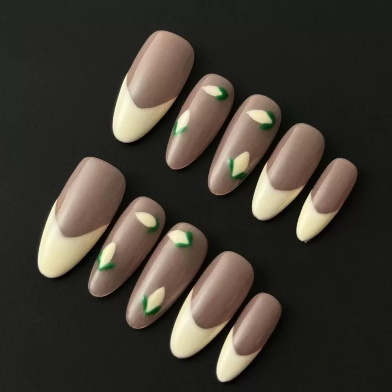 Nude floral press-on nails with cream French tips and minimalist bud design – front view