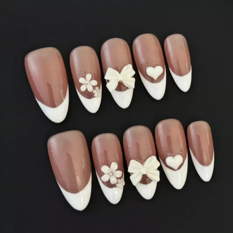 Nude French Press-On Nails with 3D bow and heart accents - front display