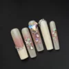 Crystal Heart Press-On Nails with nude ombre base and 3D rhinestone accents on all fingers