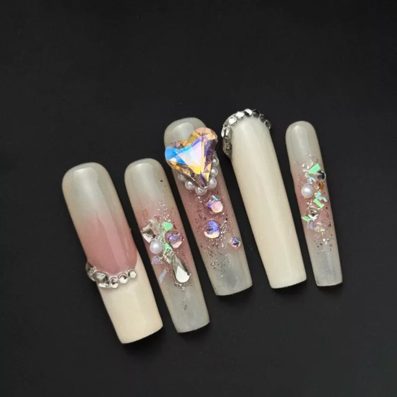 Crystal Heart Press-On Nails with nude ombre base and 3D rhinestone accents on all fingers