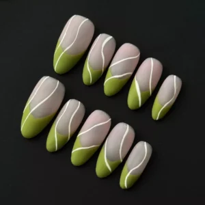 Nude green press-on nails with matte French finish and minimalist white line art – angled view