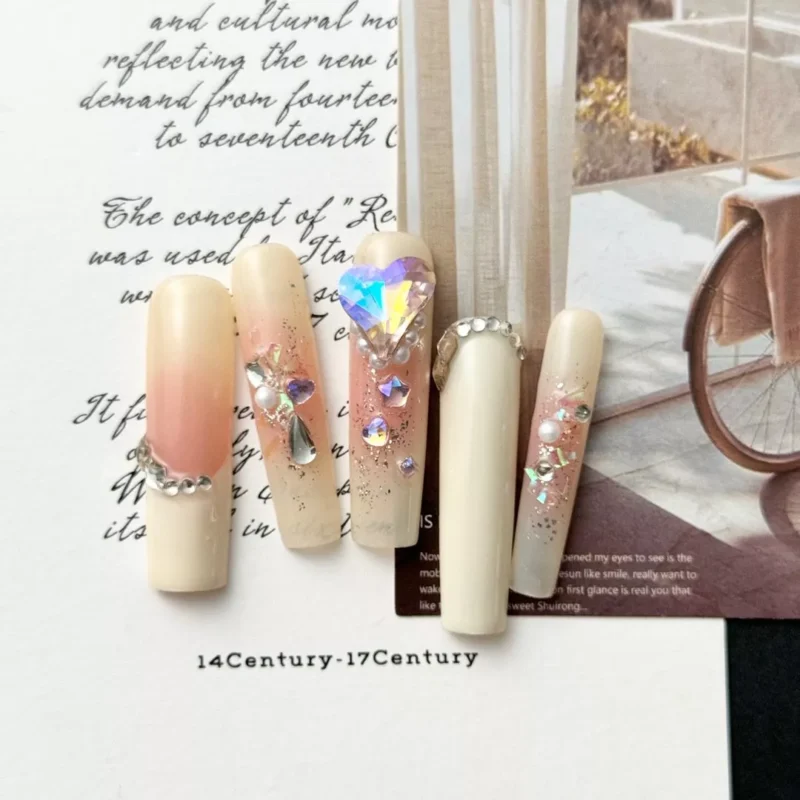 Crystal Heart Press-On Nails with nude ombre base and 3D rhinestone accents on all fingers