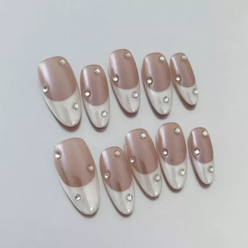 Nude and White Press-On Nails Featuring Subtle Crystal Details – Angled View