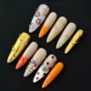 Orange gold mixed media press-on nails with rhinestone and glitter 3D accents