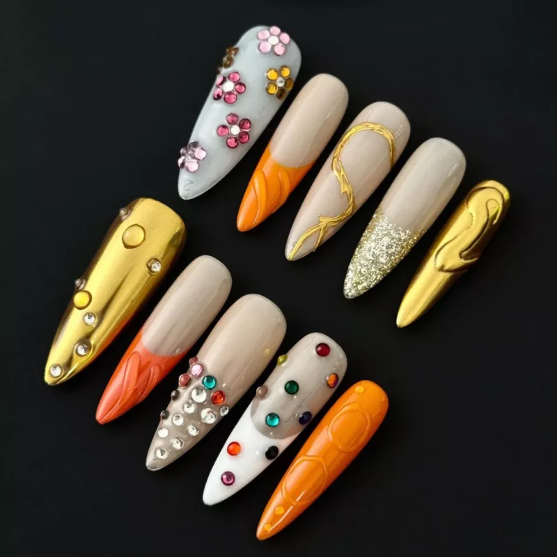 Orange gold mixed media press-on nails with rhinestone and glitter 3D accents