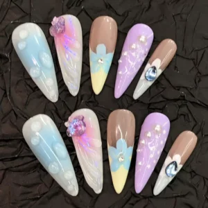 Pastel Press-On Nails featuring blue, lavender, nude and floral patterns