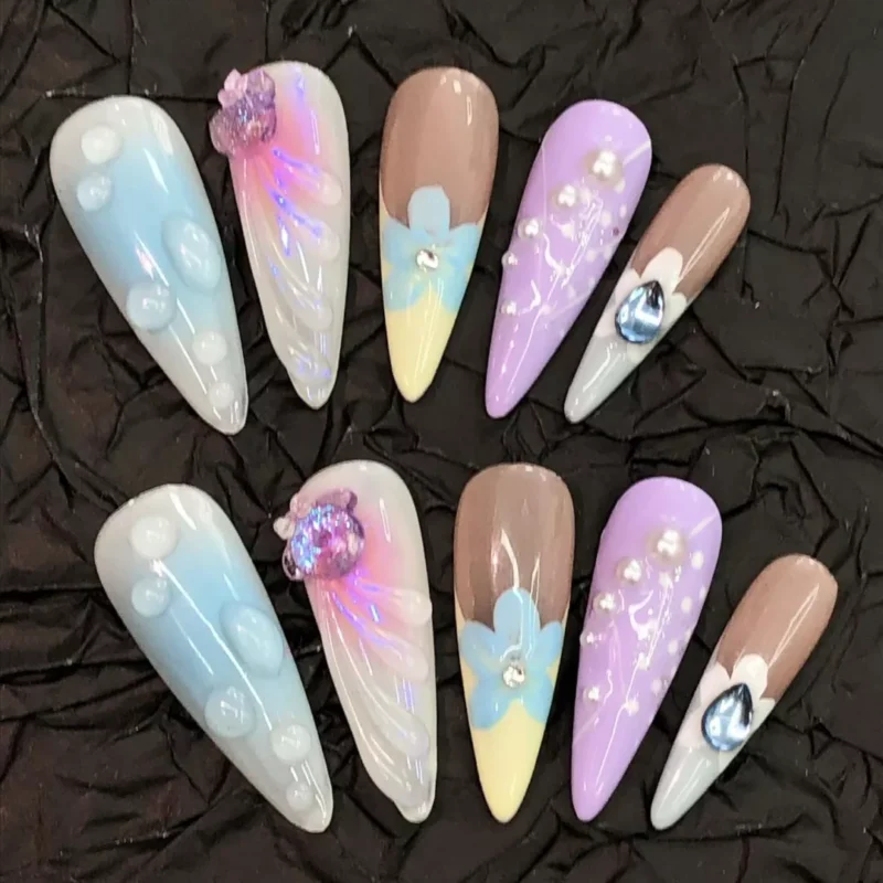 Pastel Press-On Nails featuring blue, lavender, nude and floral patterns