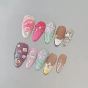 Pastel floral 3D carving nails flat lay showcasing intricate designs