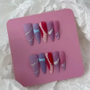 Multicolor matte almond nails with pink, blue, and mauve geometric segments