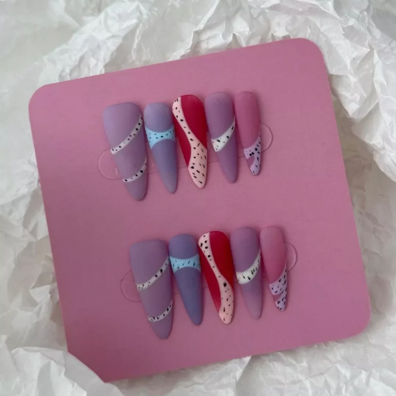 Multicolor matte almond nails with pink, blue, and mauve geometric segments
