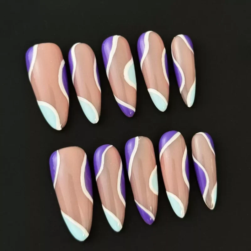 Pastel Wave Press-On Nails with nude base and purple blue swirl accents – full hand view