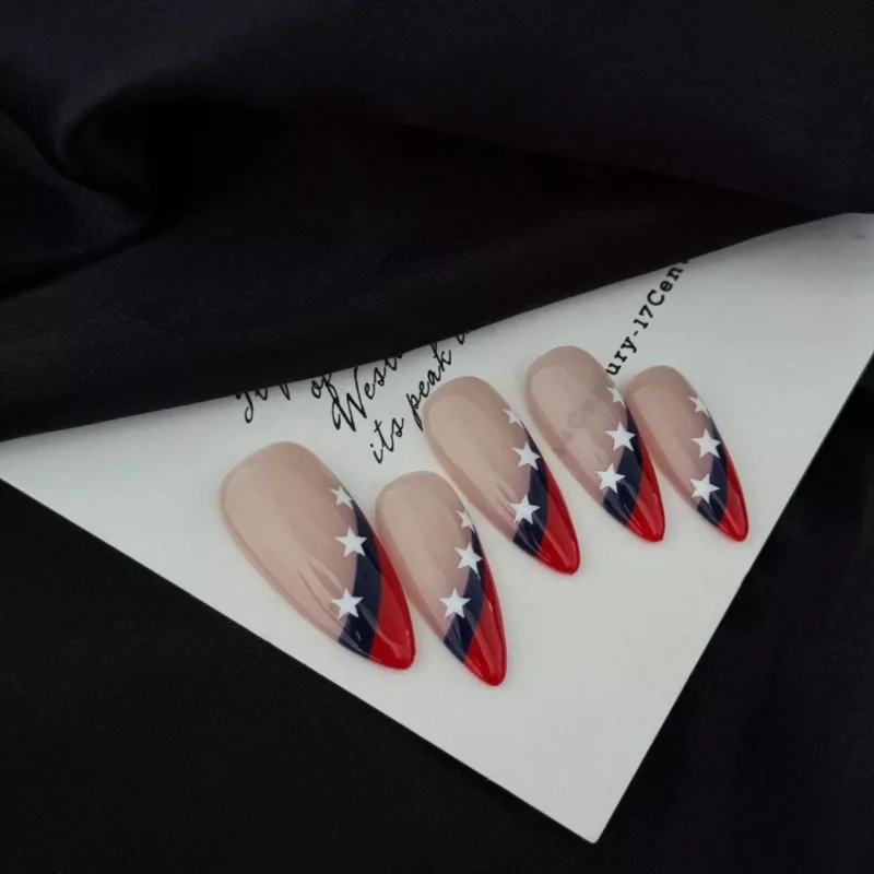Superstar press-on nails laid on art paper, showing full set and almond shape