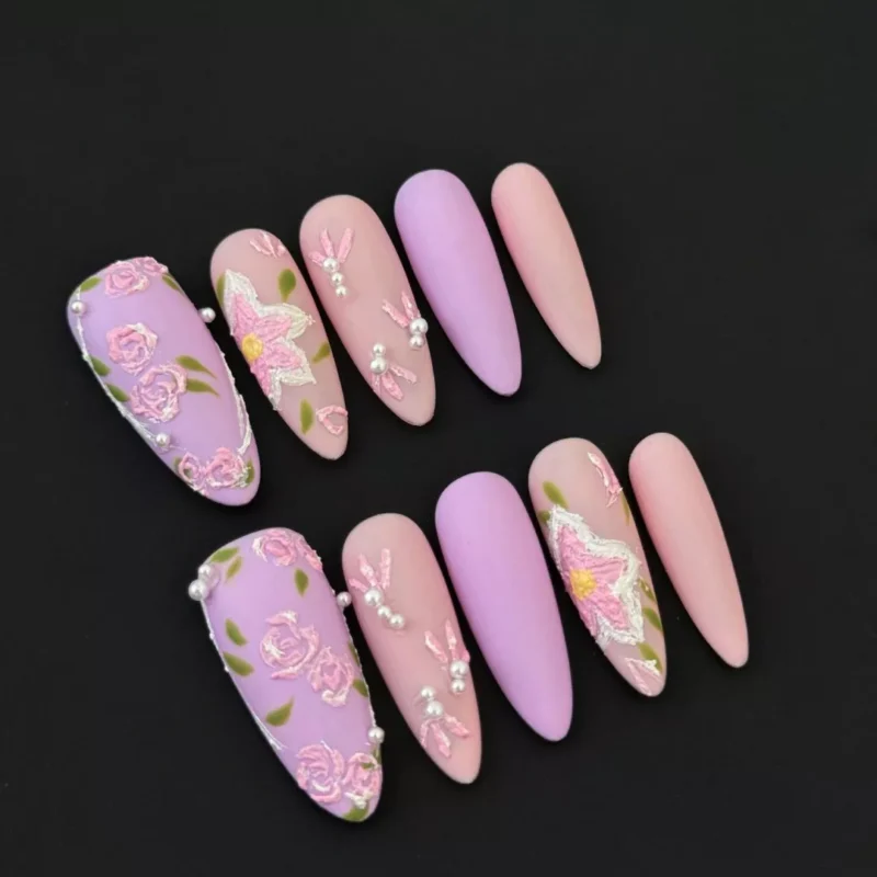 3D Floral and Pearl Accent Nails in matte pastel pink and lilac – close-up