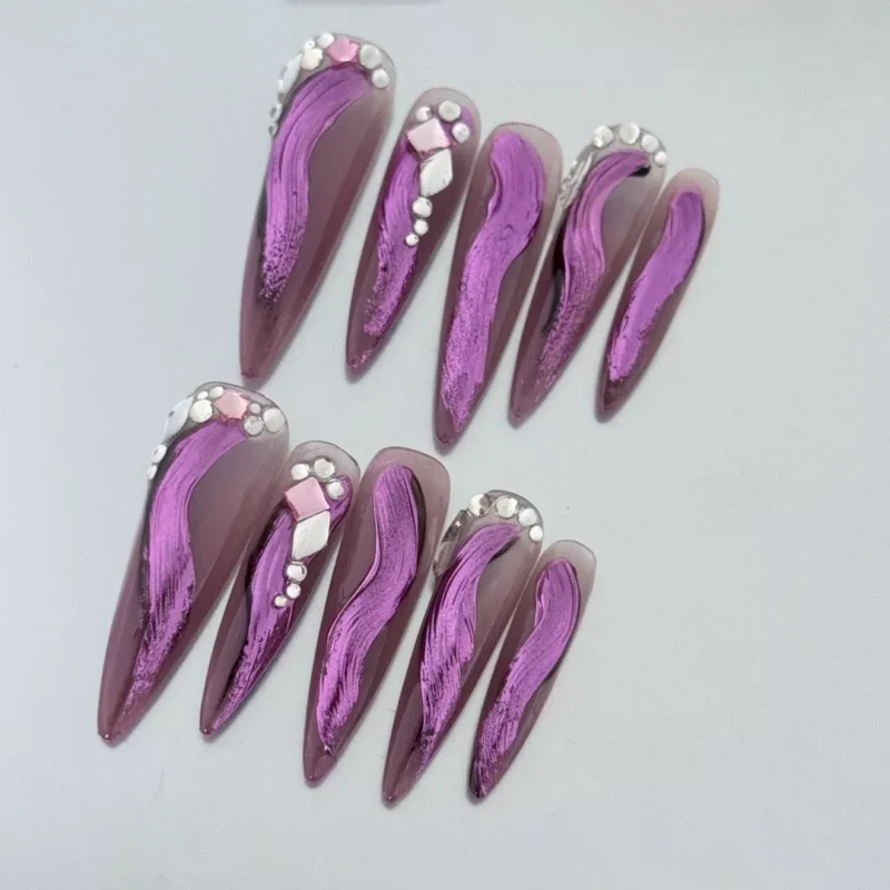 Pink chrome press-on nails with stiletto shape and nude glossy base